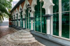 Interior of Sultan Abdul Samad Jamek Mosque with intricate Islamic architecture in Kuala Lumpur