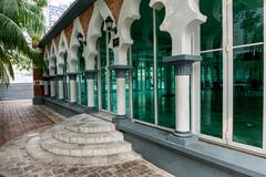 Interior view of the Sultan Abdul Samad Jamek Mosque with intricate architectural details in Kuala Lumpur