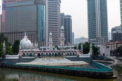 Sultan Abdul Samad Jamek Mosque and Kolam Biru viewed from bridge over Klang River in Kuala Lumpur