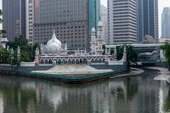 Sultan Abdul Samad Jamek Mosque and Kolam Biru in Kuala Lumpur viewed from the bridge over Klang River