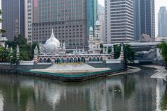 Sultan Abdul Samad Jamek Mosque and Kolam Biru viewed from a bridge along the Klang River in Kuala Lumpur
