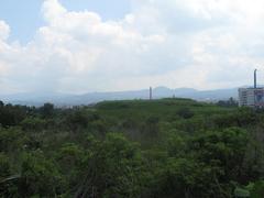 View of Cuicuilco's main circular pyramid from Anillo Periférico in Mexico City