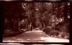 Monk walking down Via di Aque Salvie road leading to the Abbey of the Three Fountains in Rome