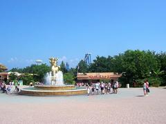 Colorful fountain with a statue of a dragon named Prezzemolo at Gardaland theme park
