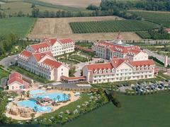 Aerial view of Gardaland Hotel complex surrounded by greenery
