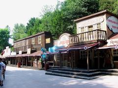 Gardaland Rio Bravo water ride with wooden structures and blue sky