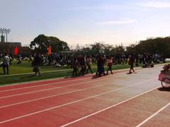 Fire drill at Kansai University track with participants evacuating