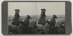 Black and white historic photograph of a woman and a girl in traditional Danish national costumes from Amager in 1904