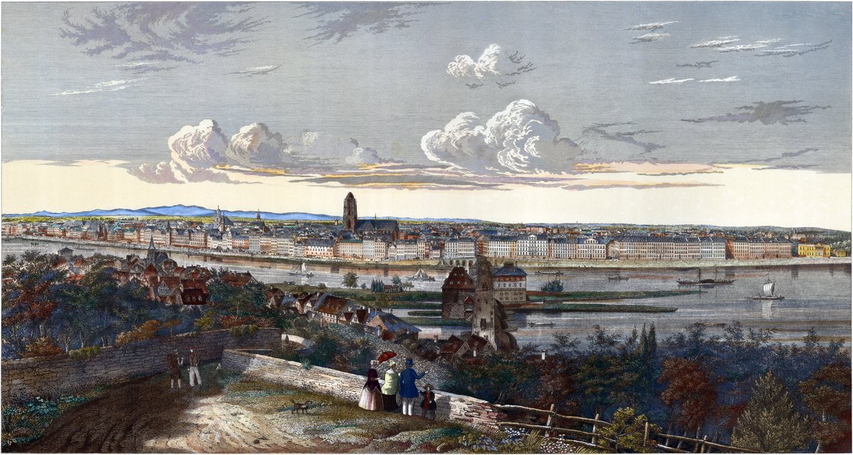 View from Sachsenhaeuser Berg in Frankfurt am Main showing historic Sachsenhausen district, the Main River with the Alte Bruecke, neoclassical buildings along the Mainkai including Alte Stadtbibliothe