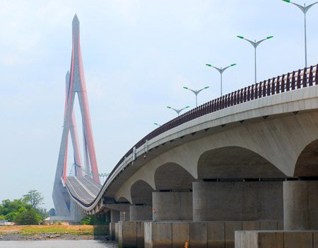 Can Tho Bridge spanning the Hau River in Vietnam under a blue sky