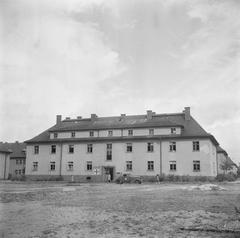 Building with inscription M.B. 57 and Red Cross symbol at Bergen-Belsen concentration camp in 1945