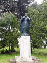 Statue of Mekhitar Sebastatsi near the entrance of the Mekhitarist Monastery
