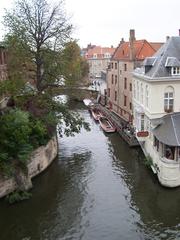 Scenic canal corner in Bruges with historic buildings and boats