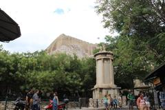 Acropolis in Athens Greece with Parthenon temple on top of rocky hill under clear sky