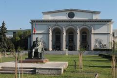 Romanian National Opera building with Statue of George Enescu in Bucharest