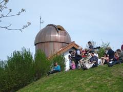 Observatory building in March, Germany with clear sky and surrounding trees