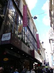 Facade of Galería General Güemes on Florida pedestrian street with modern glass curtain wall