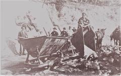 Vintage Decauville railway construction site with workers and equipment in early 1930s Italy