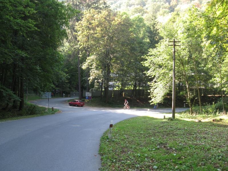 Křtinské údolí valley with Výpustek cave entrance surrounded by greenery