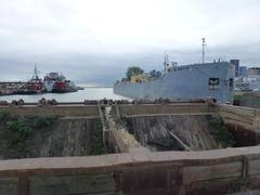 Barge moored in the Keating slip with industrial surroundings