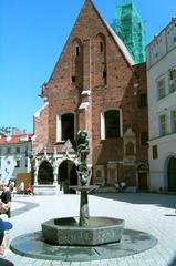 Panoramic view of Kraków cityscape with historic buildings and greenery