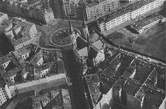 Old street view in Warsaw with historic buildings and cobblestone road