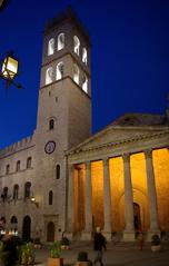 Black and white photo of Assisi Piazza del Comune with historical buildings and bell tower
