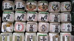 Stacks of traditional sake barrels outside a temple in Nara Park