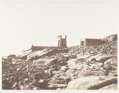 General view of the ruins at Dandour with scattered ancient stone structures and rocky landscape