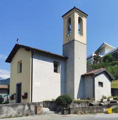 Façade of Oratorio della Beata Vergine del Rosario in Lecco with statues and ornate decorations