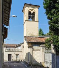 Exterior view of Chiesa della Immacolata Concezione church in Lecco with stone facade and tall bell tower