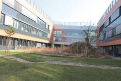 Masaryk University campus buildings with modern architecture under a blue sky