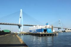 Meiko East Bridge with FUJI Trans car carrier ship passing underneath