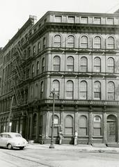 Corner view of historic cast-iron Penn Mutual Life Insurance Building in Philadelphia with semi-circle windows