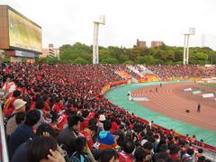 Mizuho Athletic Stadium exterior with clear blue sky