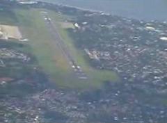 Davao International Airport runway with aircraft and control tower in view