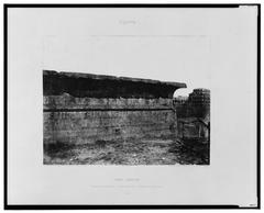 Exterior wall of sandstone construction with cornices and sculptures at Esneh (Latopolis) ancient site