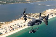 CV-22 Osprey and MH-53 Pave Low helicopters flying over coastline near Hurlburt Field Florida