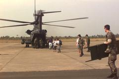 U.S. Air Force Para-rescueman with stretcher assisting evacuees from Monrovia Liberia at Freetown airport
