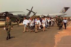 U.S. citizens and others being evacuated from Liberia by U.S. Air Force MH-53 Pavelow helicopter in Freetown airport
