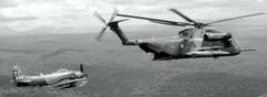 U.S. Air Force Douglas A-1H Skyraider escorting Sikorsky HH-53C Super Jolly Green Giant over Southeast Asia in 1970