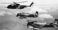 U.S. Air Force Douglas A-1H Skyraider and A-1J escort Sikorsky HH-53C Super Jolly Green Giant helicopter over Southeast Asia in early 1972