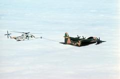 U.S. Air Force Lockheed HC-130P Hercules refueling Sikorsky HH-53C Super Jolly Green Giant helicopter over Greenland, 1978