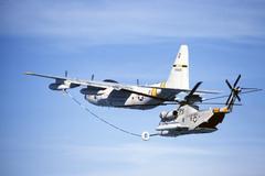 U.S. Air Force Lockheed HC-130P Hercules refueling a Sikorsky HH-53C Super Jolly Green Giant helicopter off Greenland coast in 1978