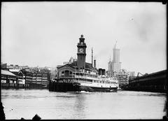 Steamer Iroquois arriving at Colman Dock in Seattle, 1915, with Smith Tower in background