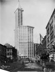 Completed Smith Tower in Seattle with window cleaning scaffolding halfway up the main building in 1914