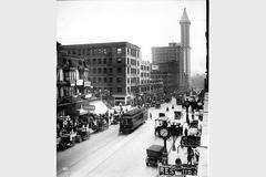 Vintage black and white photo looking south on 2nd Avenue from Marion Street in Seattle circa 1915, featuring the L.C. Smith Building