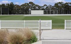 Cricket Central building at Sydney Olympic Park with gate open on Silverwater Road