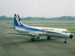 Air Nippon YS-11 aircraft taxiing at OIM airport