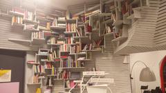 Interior view of Gothenburg Litteraturhuset featuring modern design with people reading and interacting